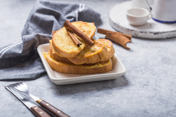 Traditional homemade Spanish torrijas on wooden background. Easter dessert.