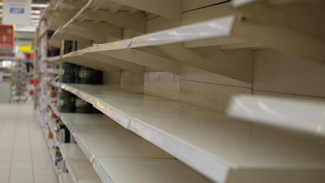 Empty shelves in store. Supermarket with empty shelves for goods