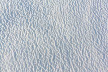 Convex snow background on the frozen surface of the river, Ob reservoir, Novosibirsk, Russia