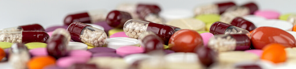 The medicine concept. Multicolored medicines background. Different remedy, pills, capsule,...