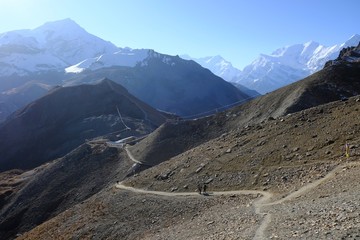 Climbing tourists on rail from Thorong High Camp (4,860m) to the Thorong La pass (5,416m), on Annapurna Circuit trek, Himalaya, Nepal