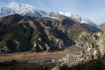 View of Annapurna range, Manang Valley and village Bhraka (Braga) with Gompa - Buddhist monastery in Himalaya, Nepal. During trekking around Annapurna - Annapurna Circuit trail