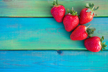 Ripe strawberries on wooden table. Fresh strawberries on wooden background
