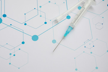 Medical syringe on the science background