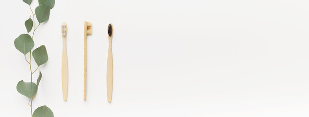 Bamboo toothbrushes for family isolated on white