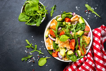 Salad with Grilled chicken, green leaves and vegetables.