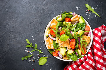 Salad with Grilled chicken, green leaves and vegetables.