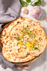 naan bread with butter and parsley