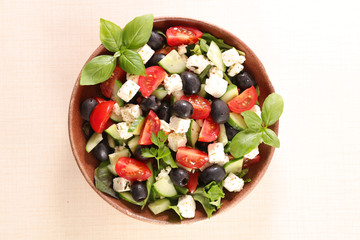 vegetable salad with feta cheese, tomato, olive, cucumber and basil