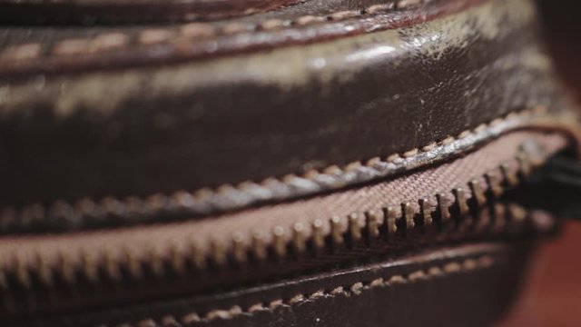 A Person Slowly Opening A Zipper - Close Up Shot