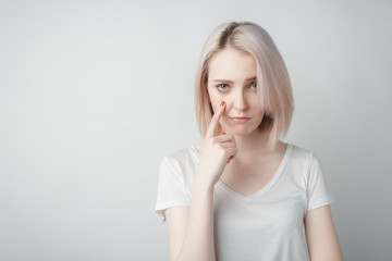 Indoor portrait of sad blonde young  woman
