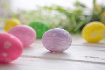 Easter eggs on a white wooden surface