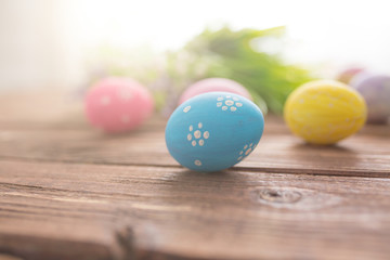 Obraz na płótnie Canvas Easter eggs on a old wooden surface