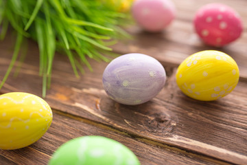 Obraz na płótnie Canvas Easter eggs on a old wooden surface