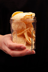 Chickpea chips and whole chickpea in glass pot.