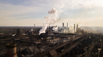 Steel ecology metallurgical iron plant smokes from pollution of industry pipes. View from the drone.