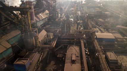 Steel ecology metallurgical iron plant smokes from pollution of industry pipes. View from the drone.