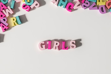 Girls made of pink wooden Letters isolated on a White Background