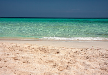 The clear waters of the wild and sunny beaches of the Illetes in Formentera in the Balearic islands of Spain.