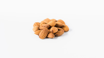 heap of almonds on a white background