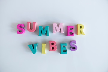 Summer word made of colorful wooden Letters isolated on a White Background