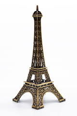 Fototapeta na wymiar European landmarks, travelling to Paris and parisian ornament concept with miniature metallic eiffel tower isolated on white background with clipping path cutout