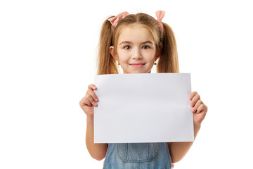 Happy cute child holding empty blank isolated on white background. kid with placard board for your...