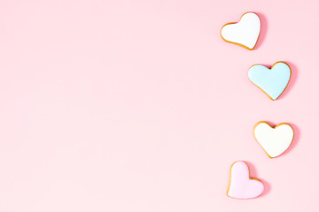 Ginger cookie in shape heart on pastel pink background. Sweet background. Valentine day food,...