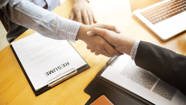 Recruitment concept, Candidate hand shaking with human resource.