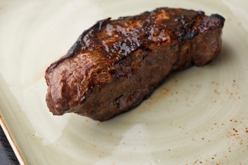 Steak. Grade A, grass fed angus beef. Traditional classic New York steakhouse menu favorite. T-bone steak, bone in, cooked to medium to rare and sliced. 