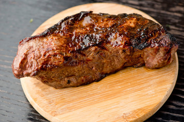 Steak. Grade A, grass fed angus beef. Traditional classic New York steakhouse menu favorite. T-bone steak, bone in, cooked to medium to rare and sliced. 