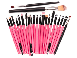 Various makeup brushes isolated on a white background