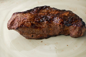 Steak. Grade A, grass fed angus beef. Traditional classic New York steakhouse menu favorite. T-bone steak, bone in, cooked to medium to rare and sliced. 