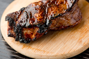 Steak. Grade A, grass fed angus beef. Traditional classic New York steakhouse menu favorite. T-bone steak, bone in, cooked to medium to rare and sliced. 