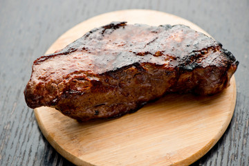 Steak. Grade A, grass fed angus beef. Traditional classic New York steakhouse menu favorite. T-bone steak, bone in, cooked to medium to rare and sliced. 