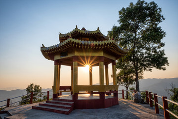 Fototapeta premium Sunset at the pavilion on Doi Mae Salong in Chiangrai,Thailand.