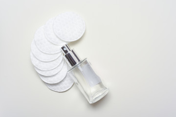 Facial cleansing products and containers with face creams and cotton wool pads