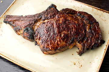 Steak. Grade A, grass fed angus beef. Traditional classic New York steakhouse menu favorite. T-bone steak, bone in, cooked to medium to rare and sliced. 