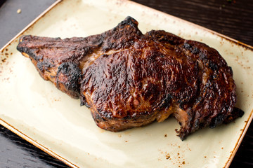 Steak. Grade A, grass fed angus beef. Traditional classic New York steakhouse menu favorite. T-bone steak, bone in, cooked to medium to rare and sliced. 