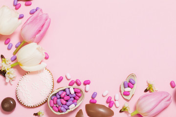 Easter pink background with eggs and flowers