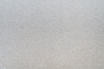 Background from sheet of recycled cardboard. Close-up detail macrography view of light gray abstract texture recycled eco-friendly carton material pattern background.