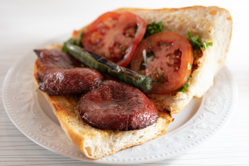 fresh turkish sausage in bread with tomato