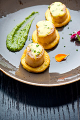 Scallops. Sea Scallops seared in brown butter sauce and garnished with a lemon sauce. 