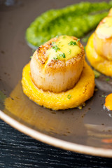 Scallops. Sea Scallops seared in brown butter sauce and garnished with a lemon sauce. 