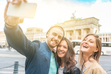 Multiracial group of friends taking a selfie in Berlin