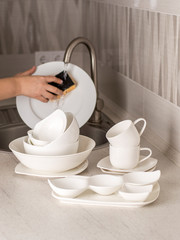 white dishes on the kitchen table.