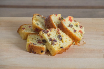 Fruit cakes on the wooden chopping board.