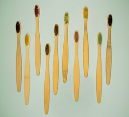 Eco toothbrushes on green background