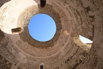 The blue sky seen through the vault of a historic building