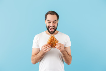 Portrait of a young cheerful bearded man wearing t-shirt